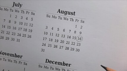marking 16 August date on the calendar	
