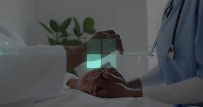 Nurse holding patient hands in hospital room, overlaying floating stethoscope icon and health data