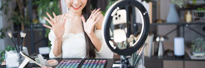 Beauty influencer Asian girl Using Social Media for live streaming on Smartphone online audience like and subscribe to her channel. Like, Follower, Comment