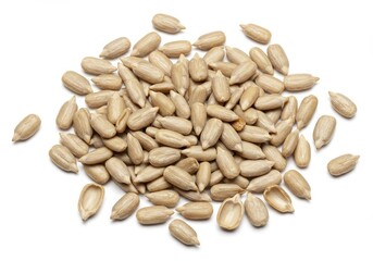 A pile of hulled sunflower seeds scattered on a white surface in a close up studio shot image view