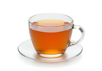 A clear glass cup filled with brown tea on a clear saucer isolated on a white background in studio shot