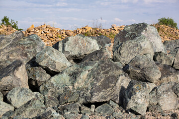 Collection of large stones and pebbles natural rock pile under open sky.