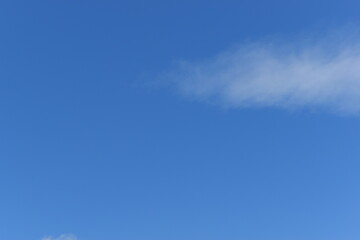 beautiful blue sky and white fluffy group of clouds with sunrise in the morning, natural background