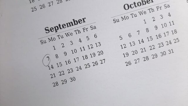 marking 7 September date on the calendar	
