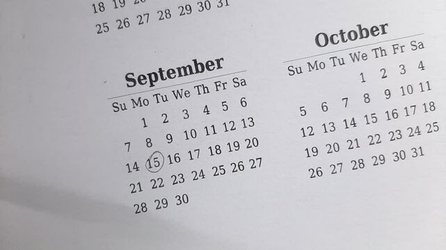 marking 15 September date on the calendar	
