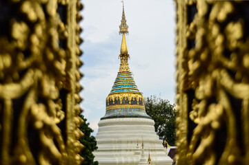 Fototapeta premium Pagoda and Chapel, Lanna Architecture, Symbols of Buddhism, South East Asia at Wat Buppharam, Chiang Mai, Northern Thailand