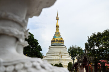 Fototapeta premium Pagoda and Chapel, Lanna Architecture, Symbols of Buddhism, South East Asia at Wat Buppharam, Chiang Mai, Northern Thailand