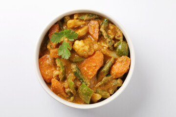 Indian traditional cuisine food mix veg curry made with carrots potatoes cauliflower beans and bell peppers with tandoori roti