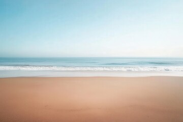 Obraz premium Serene coastal landscape with a vast sandy beach and a tranquil ocean.