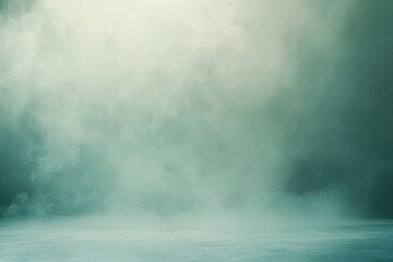 Fototapeta premium A soft mint glow surrounds a gray studio backdrop in near silence.