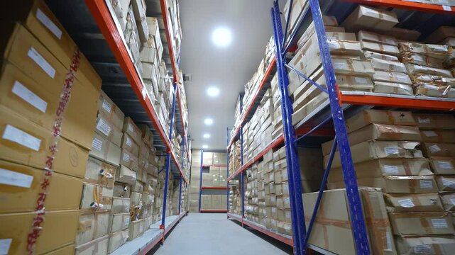 pharmaceutical werehouse. carton boxes in warehouse area cleanroom racks for storage and epoxy flooring in a pharmaceutical manufacturing factory for active pharma chemicals, cardboard box