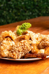Deliciously Crispy Fried Chicken Accompanied by an Attractive Garnish Served on a Plate