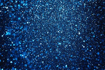 Blue glitter background with shimmering bokeh effect creating a sparkling and festive atmosphere