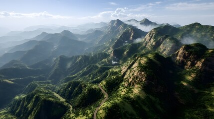 Naklejka premium Aerial View of Lush Green Mountains Winding Road Scenic Landscape