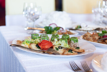 Elegant Plate of Appetizers with Vegetables and Garnishes on a Table