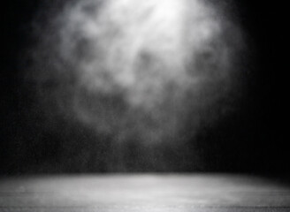 Abstract bokeh from water droplets on wooden table, dark background, shot in studio.