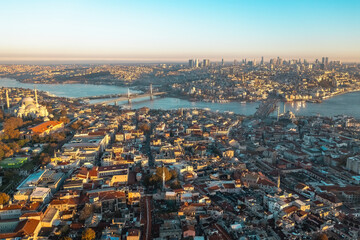 Istanbul aerial view. Aerial wide angle view of the Halic Metro Bridge and Galata Bridge at sunset. Istanbul, Turkey