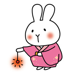 ピンクの浴衣を着て線香花火をする白いうさぎ