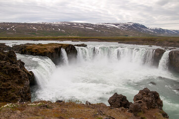 Godafoss Iceland, landscape with water flowing over waterfall