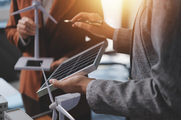 Discussion among businesspeople on the latest developments in solar cell panel technology and Solar...