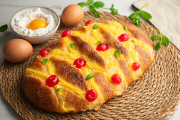 Coca San Juan, a traditional Catalan dessert similar to brioche with pastry cream and candied fruit. Top view table.