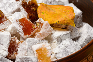 Sweet food Turkish delight on wooden background, assorted locum and candy for decorated backdrop