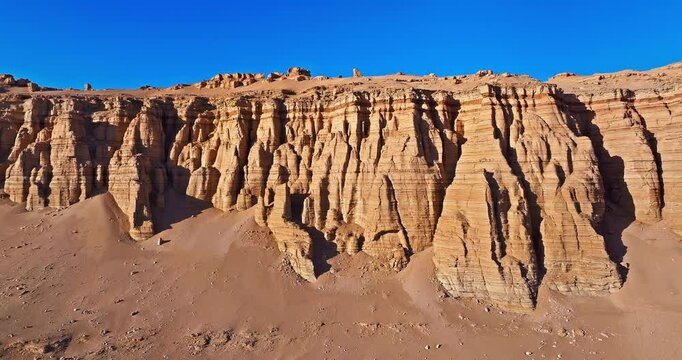 Aerial view of the yardang landform mountain in desert. Famous Dahaidao no man's land natural landscape in Xinjiang, China.
