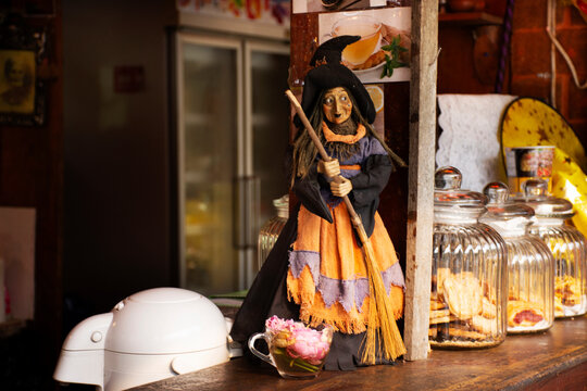 Old woman witch figurine and haunted house cafe coffee shop in garden outdoor on forest mountain at pai city hill valley in Mae Hong Son, Thailand