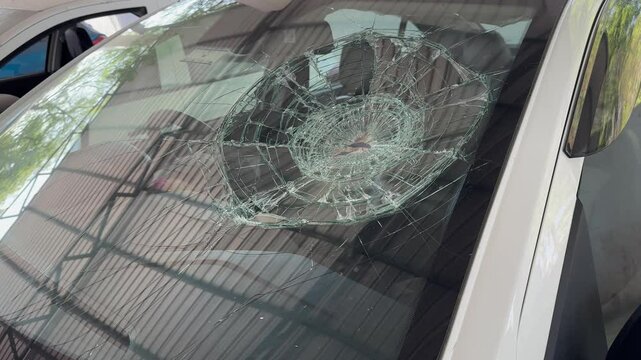 Bullet holes on the windshield of car, Bullet holes. Smash car windshield, broken and damaged car