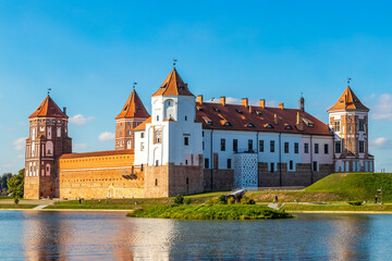 Fototapeta premium Mir Castle majestic fortification fortress Park monument with lake Belarus.