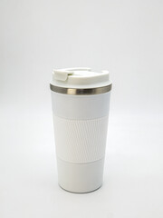 White thermo mug with lid on white background close-up