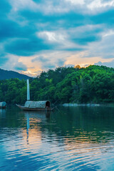 Mountains, Oujiang River, fishing boats, and ancient towns in Lishui City, Zhejiang Province, China On May 24th, 2024	