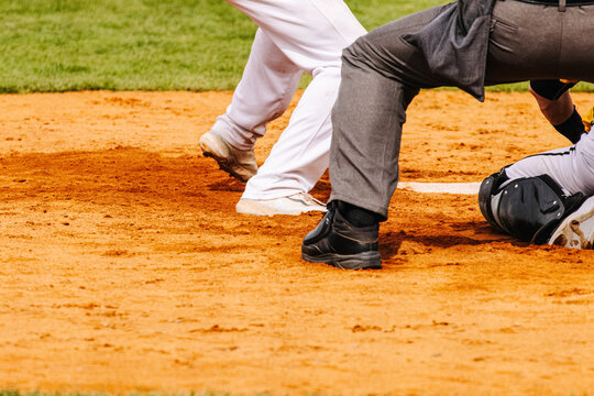 Baseball sport detail, close view of baseball players and umpire