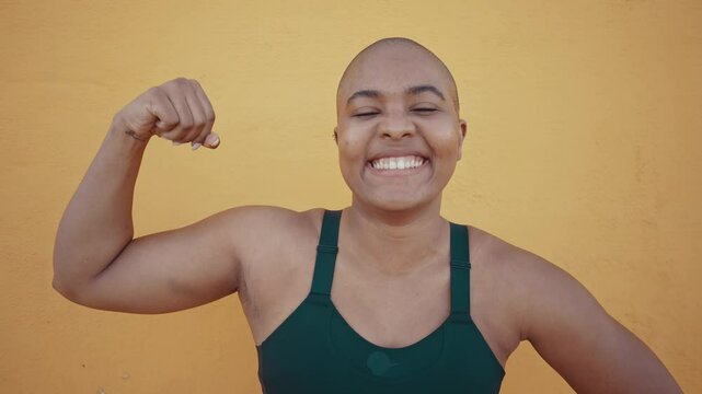 Muscular plus-size athlete standing confidently against concrete wall, embodying strength, determination, and body positivity with intense gaze .