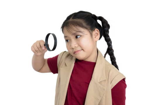Girl is looking through a magnifying glass on an isolated background
