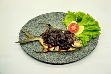 Grilled spadefish (bawal bintang) with rich Parape sauce, a traditional Indonesian dish known for its bold, sweet-savory flavor and aromatic spices.