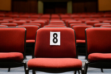 Empty theater seats waiting for moviegoers at a local cinema in the evening