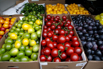 Fresh fruits and vegetables display at local market showcasing vibrant colors and healthy choices in the afternoon sun