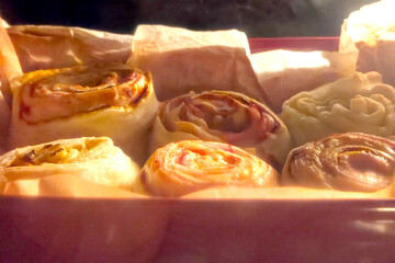 Baking Fresh Homemade Puff Pastry Rolls in Oven - Culinary Delight for Baking Enthusiasts