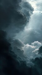Fototapeta premium Dramatic sky with dark ominous clouds and a burst of light creating a sense of awe and wonder showcasing nature's power and beauty in a vertical composition