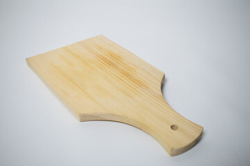 A plain wooden cutting board with a smooth surface and light wood grain, perfect for kitchen use.