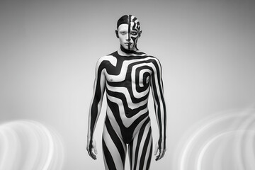Striking Black and White Body Art Model in Abstract Spiral Patterns Under Dramatic Lighting