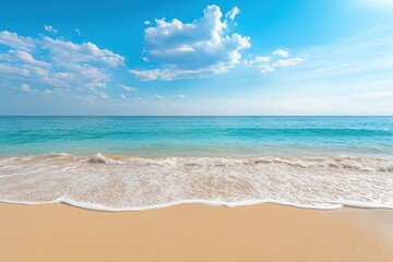 Fototapeta premium Sunny coastal scenery with soft waves and sandy shore.