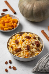 Rice millet porridge with pumpkin and cinnamon. Healthy breakfast