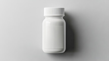 Clean top-down view of a white plastic medicine bottle on a smooth gray surface