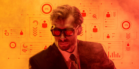 Conceptual design. Man in suit under zero percent data icons with red light representing economic freeze and halted growth. Glowing red effect. Concept of economic crisis and depression, hardship.