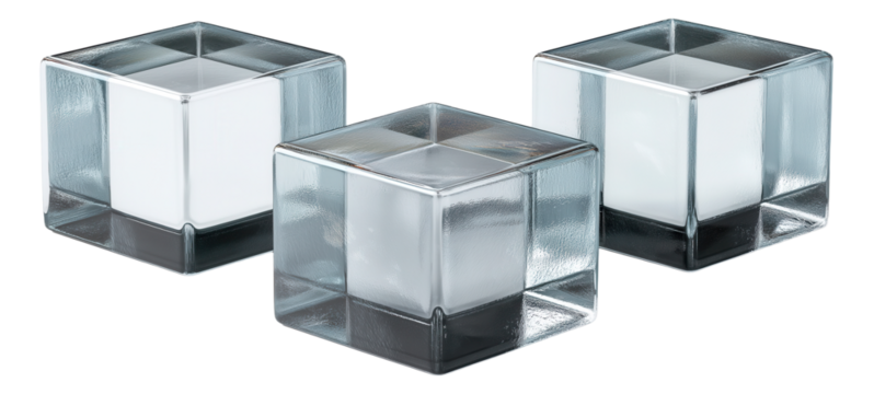 Three clear glass cube candle holders with frosted interiors arranged in a row.