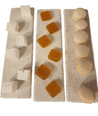 Macarons and Turkish Delight on a Long Plate isolated