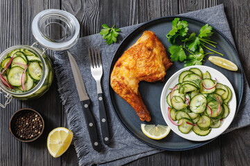 roast chicken leg with salad on a plate