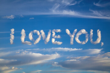 Heartfelt Message in the Sky: 'I Love You' Formed by Soft Clouds Against a Clear Blue Background